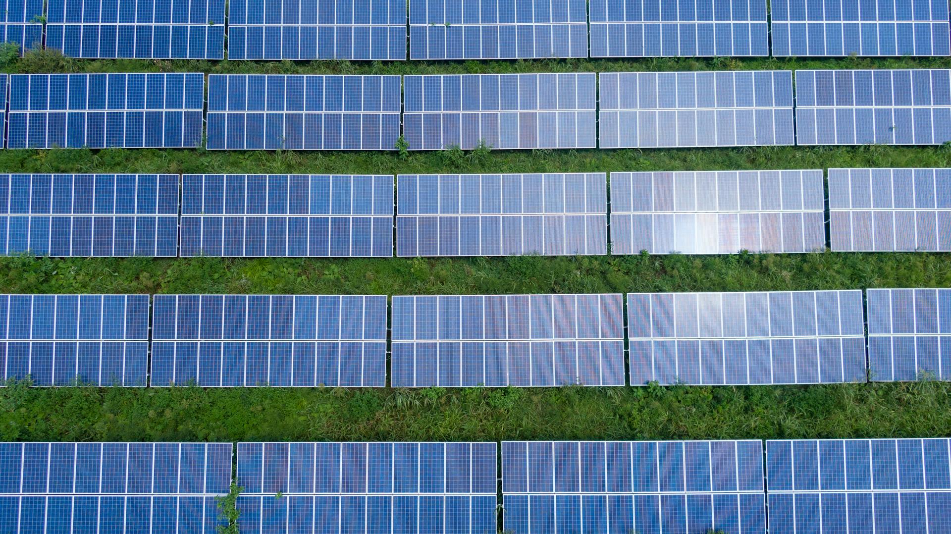 Aerial view of a ground-mounted solar array on a farm in Bushenyi, Uganda